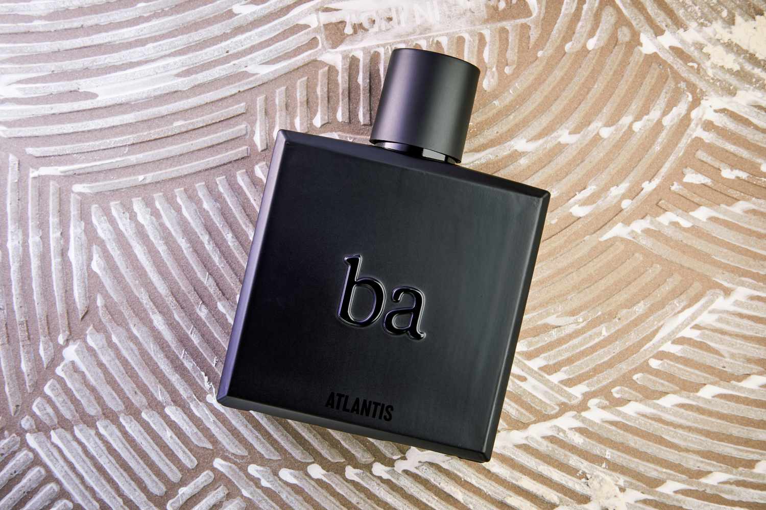 The Blu Atlas Atlantis Eau de Parfum on textured background