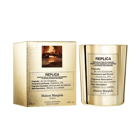 replica by the fireplace gold candle